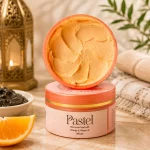 Luxury skincare product image of Pastel Moroccan Mud with Orange & Vitamin C with soft natural shadows and minimal background