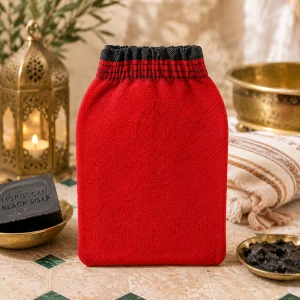 Original Moroccan exfoliating fiber glove in a luxury Moroccan spa setting with traditional bath accessories